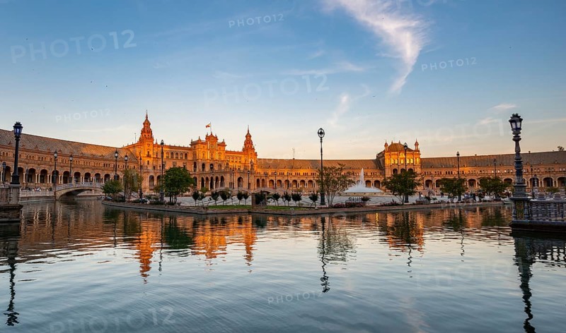 Plaza de Espana in the evening light with reflection in the canal