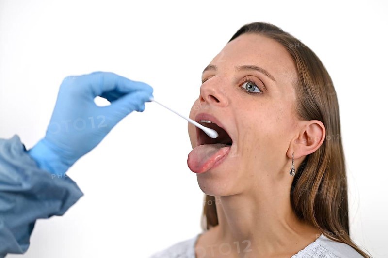 Woman receives throat swab