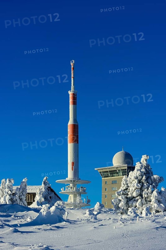 Transmitter mast and Brocken hostel on the winter snow-covered Brocken