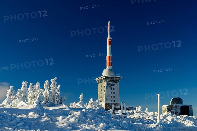 Transmitter mast and Brocken hostel on the winter snow-covered Brocken