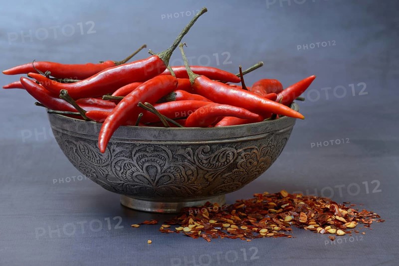Chilli peppers in shell and chilli flakes