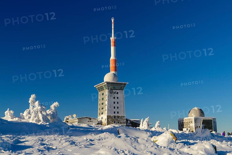 Transmitter mast and Brocken hostel on the winter snow-covered Brocken