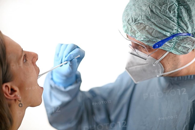 Woman receives throat swab