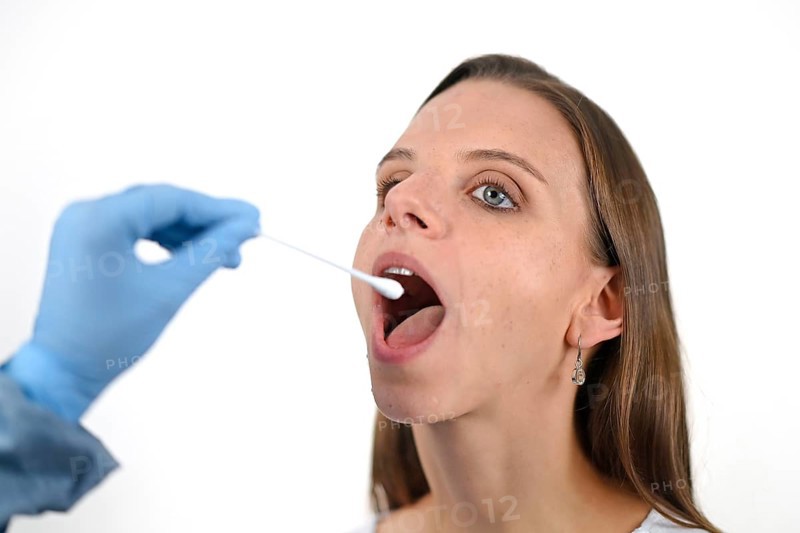 Woman receives throat swab