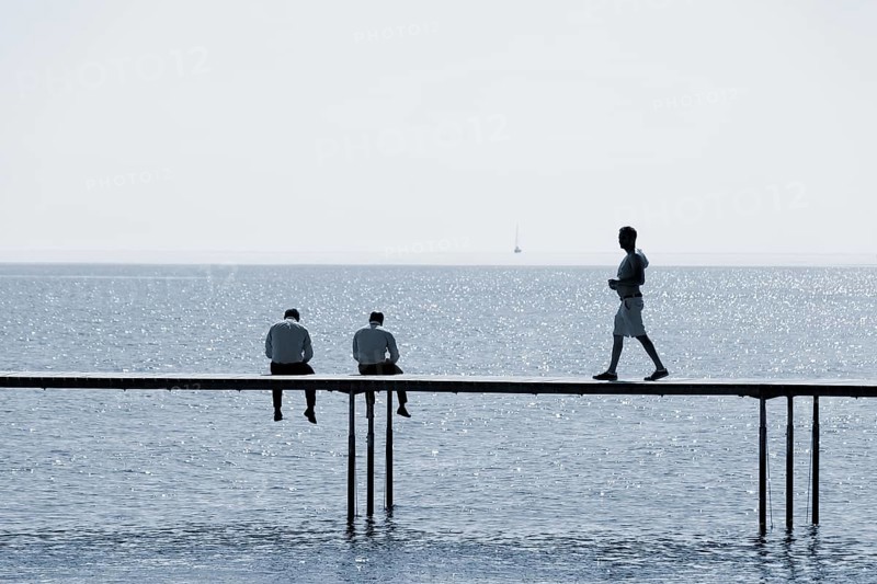 Two men are sitting