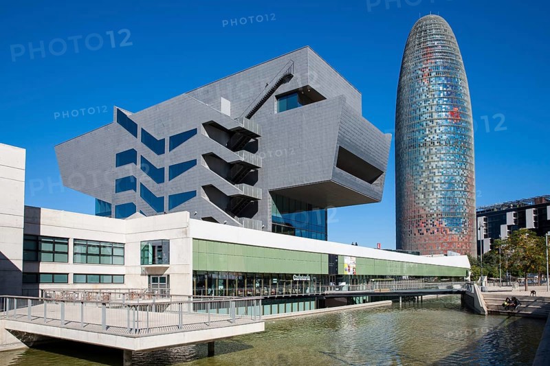 Skyscraper Torre Agbar with the museum Museu del Disseny de Barcelona