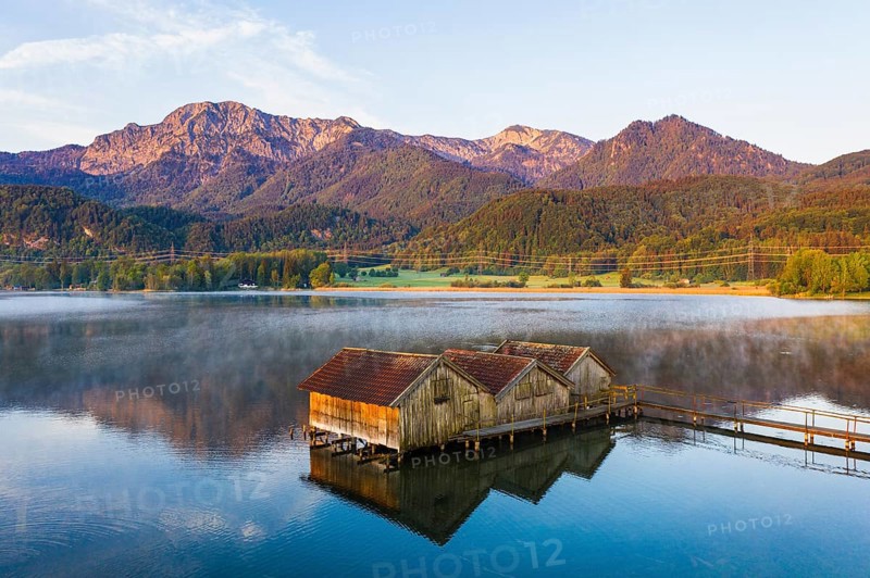 Boathouses in the Lake Kochel near Schlehdorf in the morning light