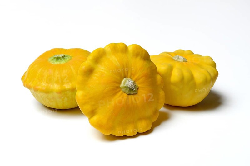 Three yellow patisson pumpkins