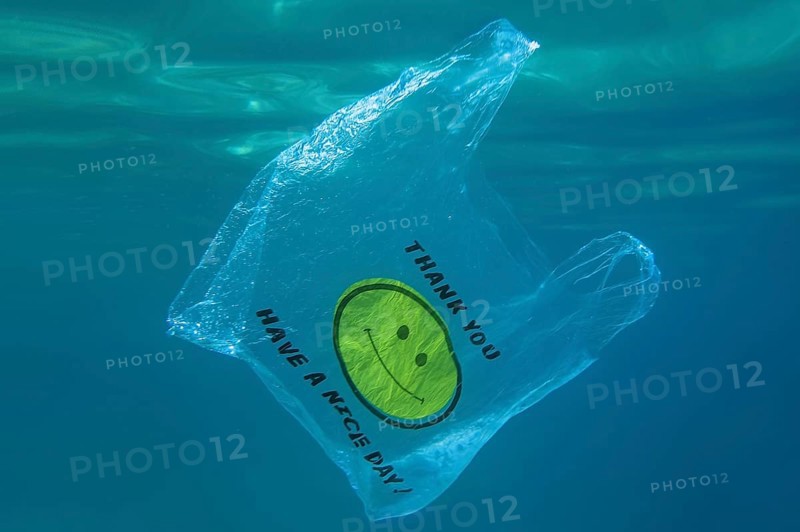 A plastic bag with a yellow smiley face and the words thank you