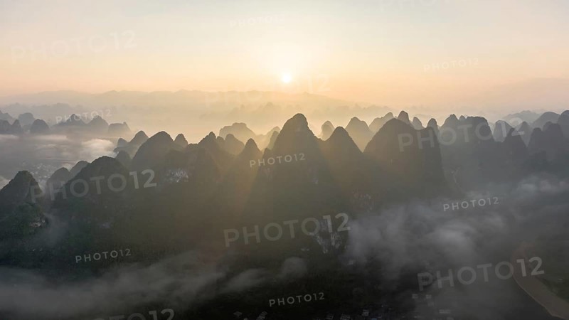 Chinese karst mountains at the Yangshuo River at sunrise