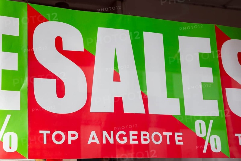 Shop window with sign SALE