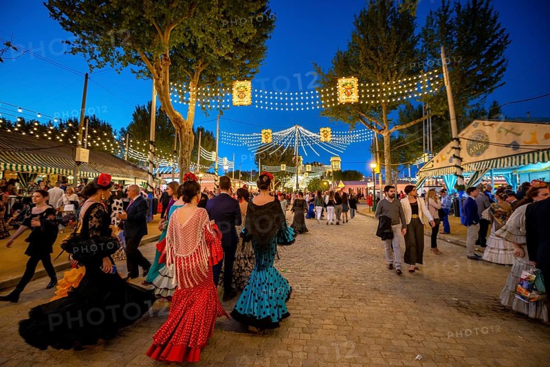 Spanish women with colorful flamenco dresses