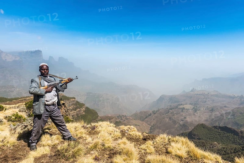 Sentry with rifle in the mountains