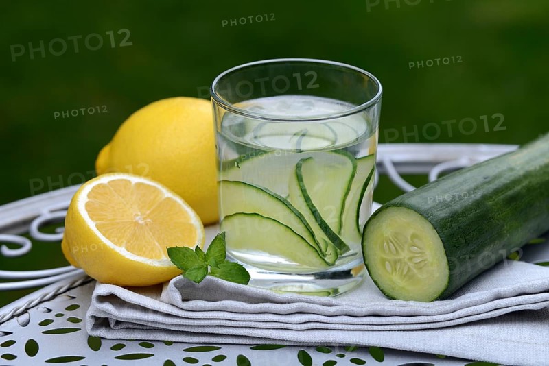 Cucumber water in glass and lemon