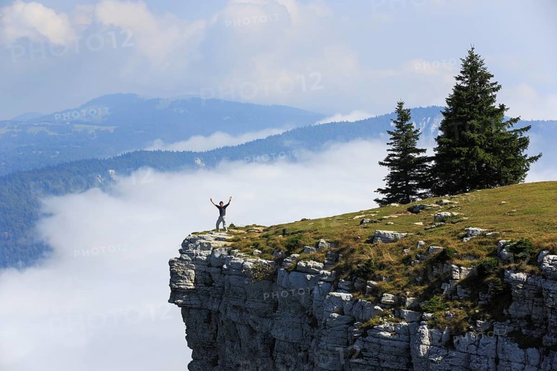 Man standing edge of the Creux du Van