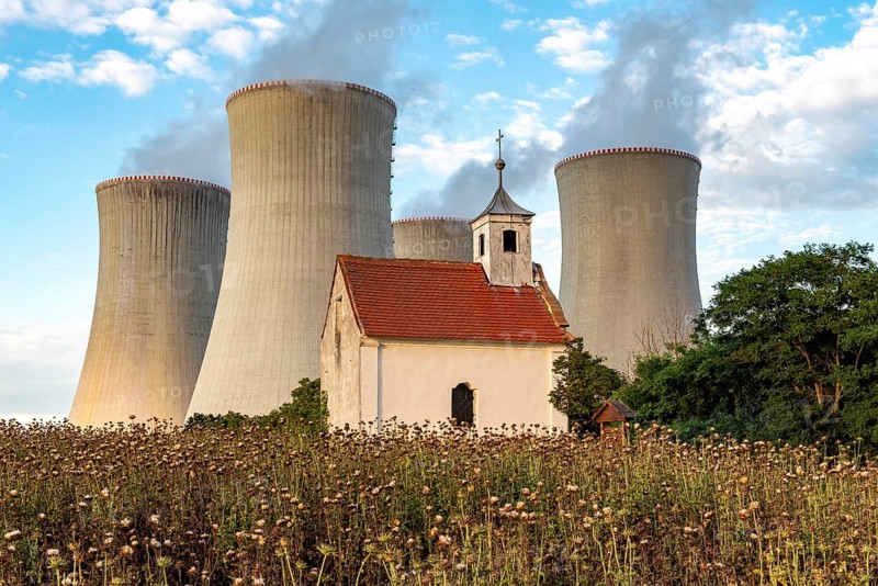 Old abandoned chapel and cooling towers of Dukovany Nuclear Power Station