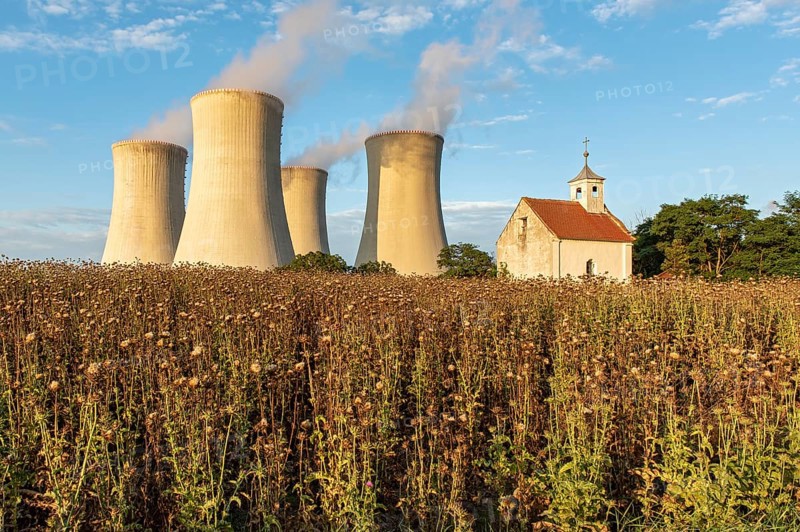 Old abandoned chapel and cooling towers of Dukovany Nuclear Power Station