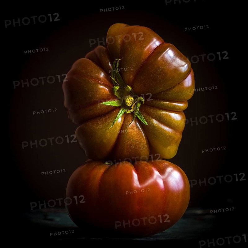 Two black Crimean tomatoes