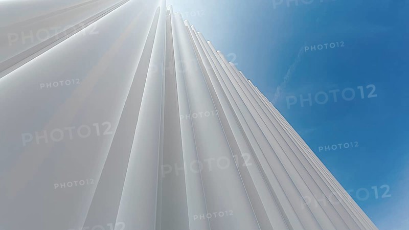 Modern white facade of corrugated acrylic glass