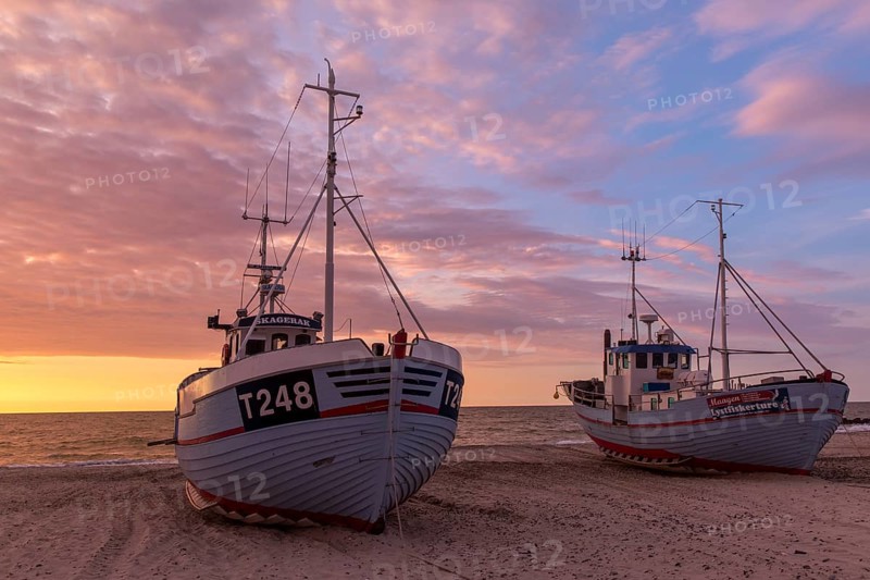 Fishing boats at sunset at the port of Vorupoer