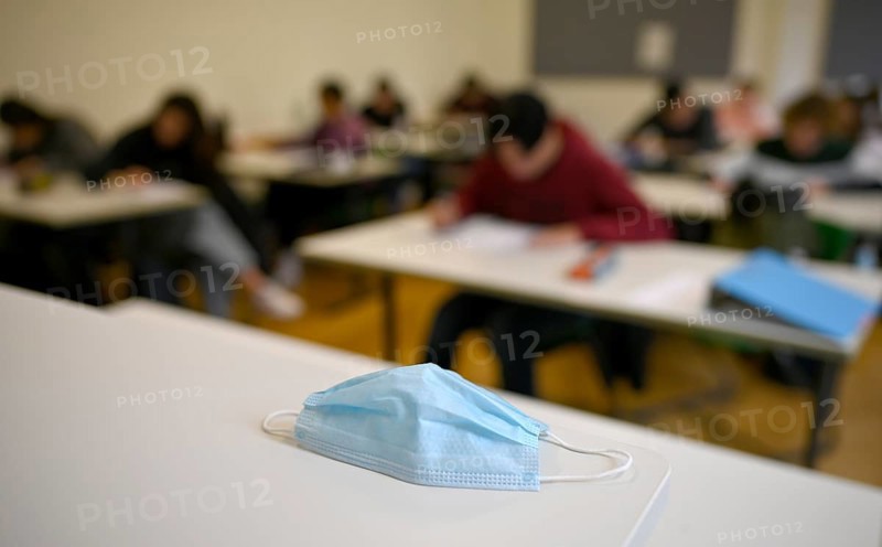 Face mask on student's desk