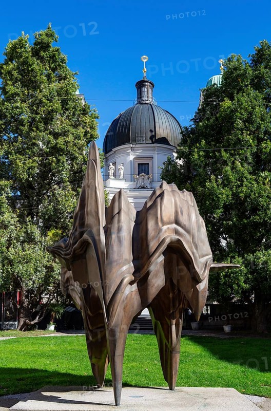 Bronze statue Caldera at Makartplatz with Trinity Church