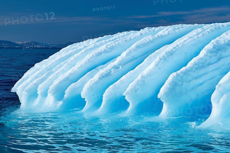 Rugged iceberg drifting through Icefjord