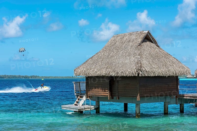 Water sports and overwater bungalow in the lagoon