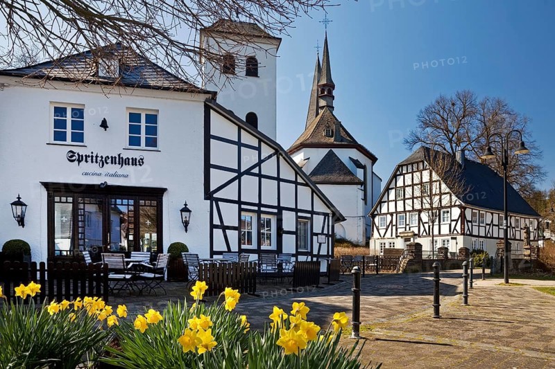 Half-timbered houses around the parish church of St. Peter and Paul in spring