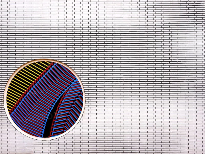 Part of a brick wall with a circular mosaic