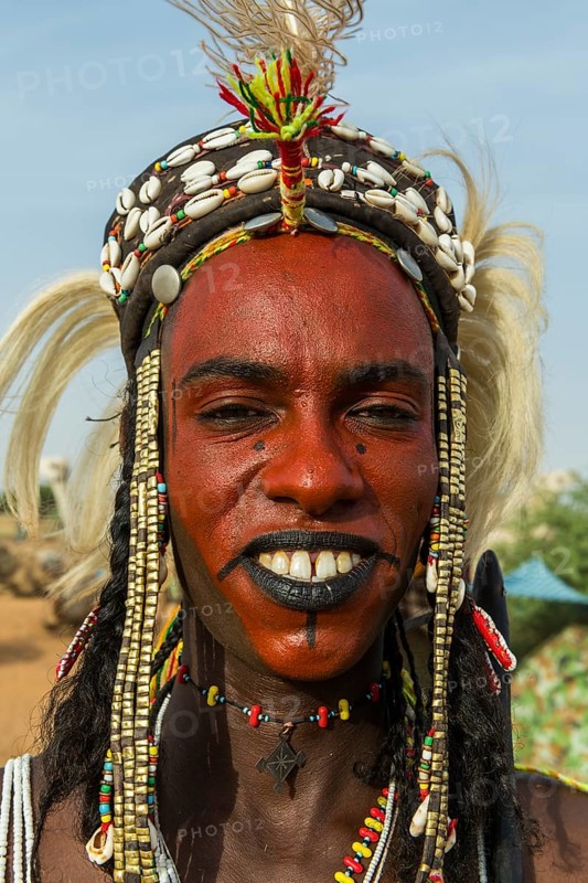 Wodaabe-Bororo man with face painted at the annual Gerewol festival