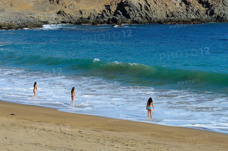 Bathers at the beach of Quebrada de la Huaca