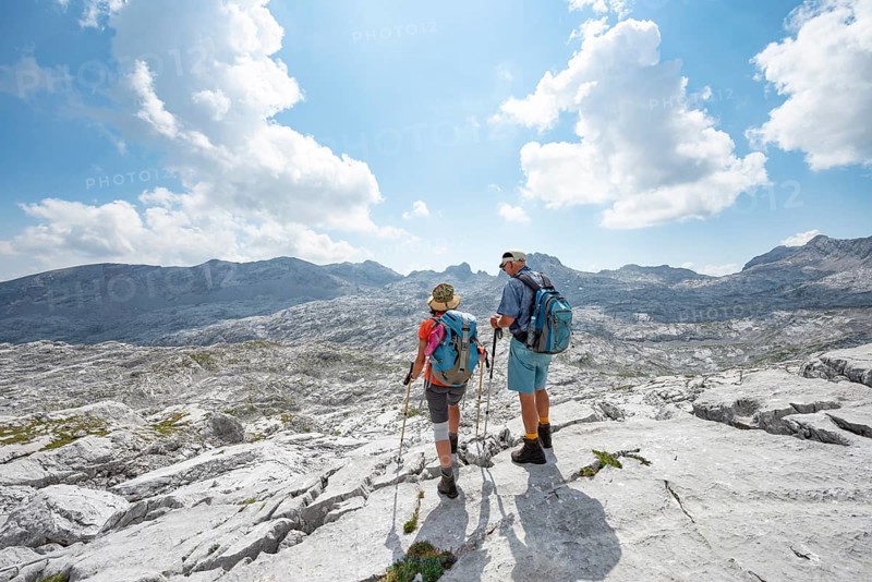 Two hikers look into the distance