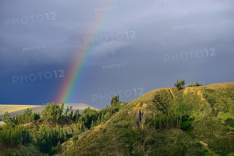 Rainbow in front of dark clouds