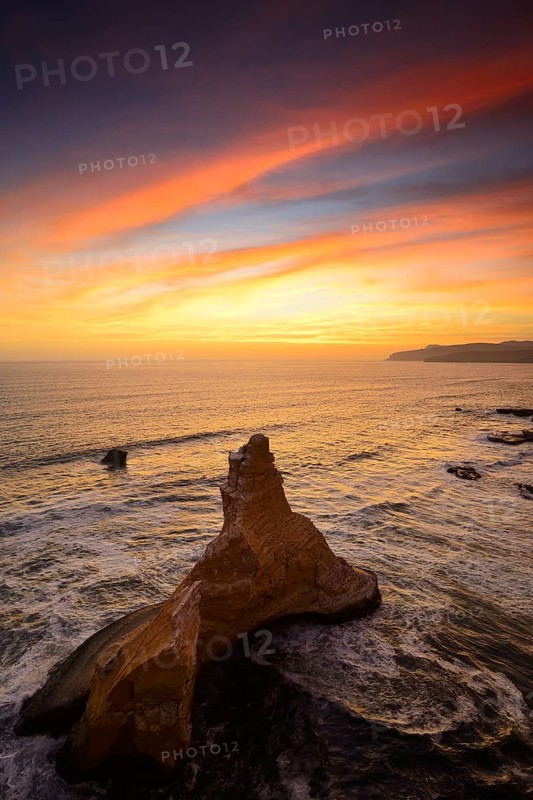 Evening mood over the rock Catedral at Playa Supay