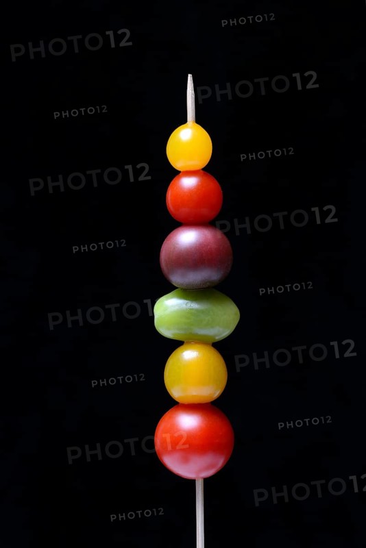Various cherry tomatoes on wooden skewers
