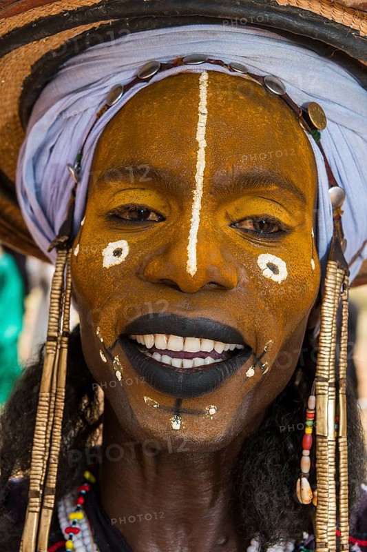 Wodaabe-Bororo man with faces painted at the annual Gerewol festival