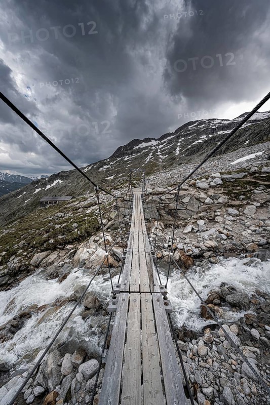 Suspension bridge over torrent at the Olpererhuette