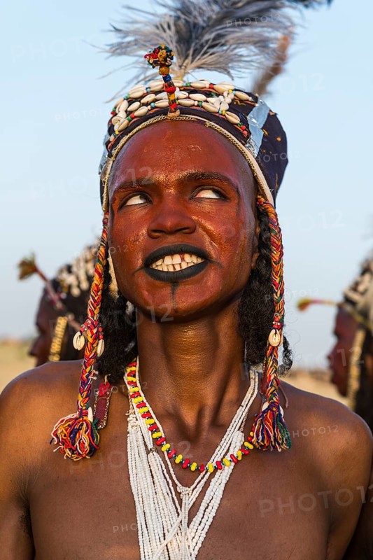Wodaabe-Bororo man with his face painted at the annual Gerewol festival