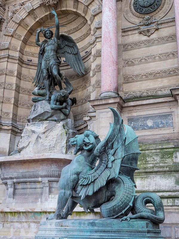 Bronze statue of the fountain La Fontaine Saint Michel at Place Saint-Michel