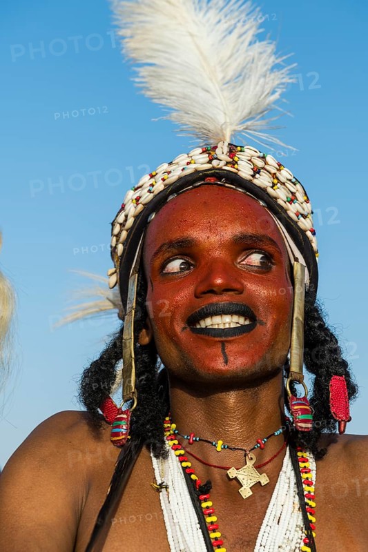 Wodaabe-Bororo man with his face painted at the annual Gerewol festival