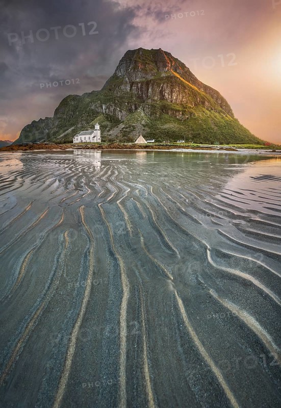 Gimsoy church in front of a sandy beach with ribbed structure