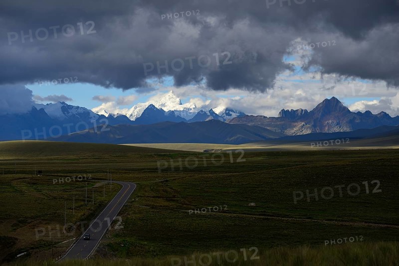 Mountain range of the Cordillera Blanca under dark clouds