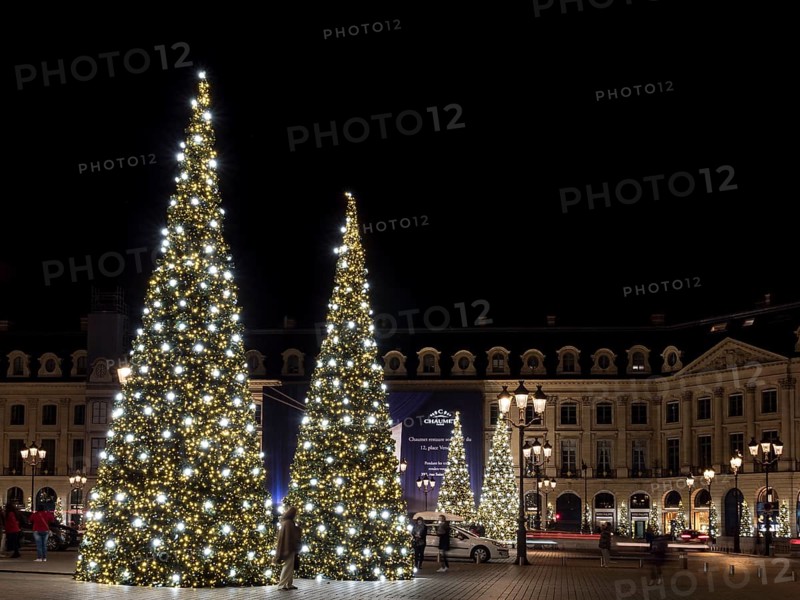 Night shot of illuminated Christmas trees at Place Vendome
