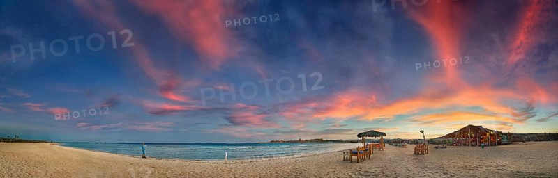 Sandy beach beach and coral reef Abu-Dabbab at sunset