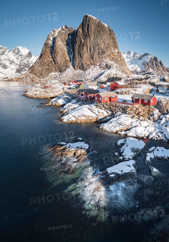 Rorbuer fishermen's cabins on the snowy fjord