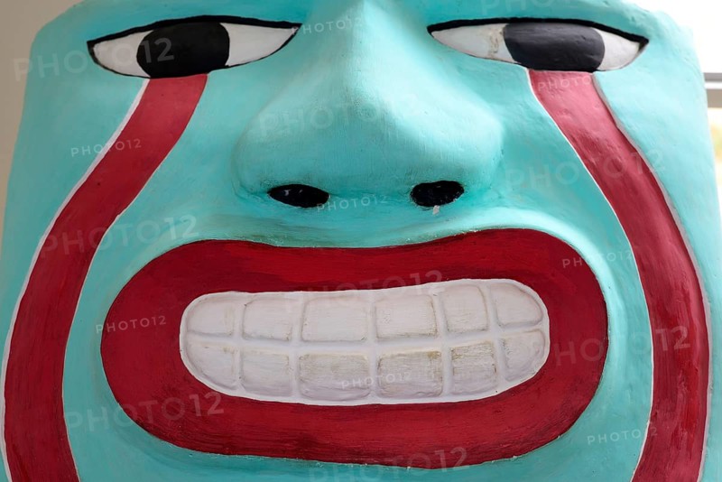 Freshly painted head of the Sechin culture