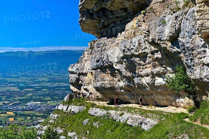Narrow balcony path La Corraterie with panoramic view of the Geneva basin on the way to the summit Mont Saleve