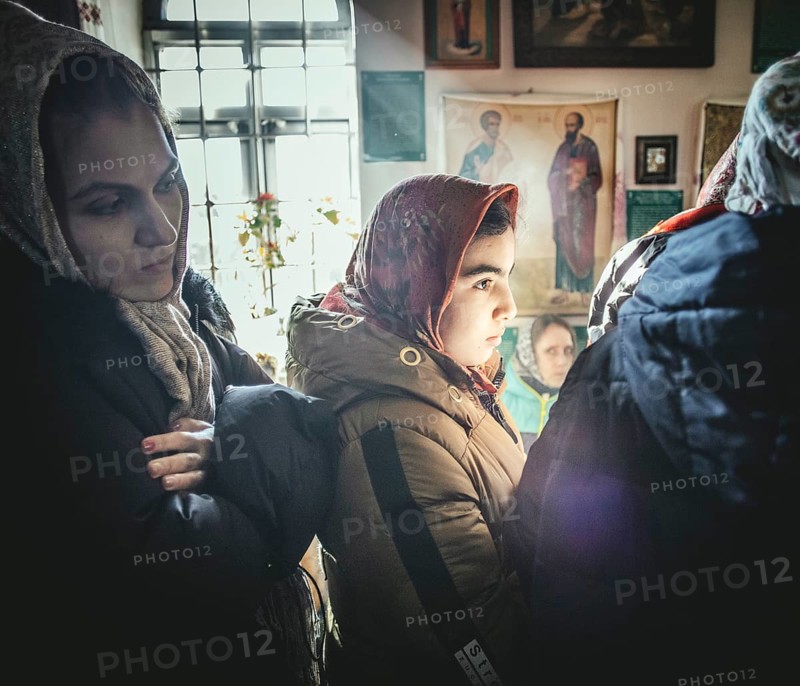 Believers during an exorcism in the church of Father Sergei in Ochamchira