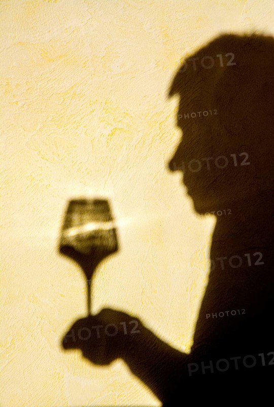 Hand holding a glass of wine